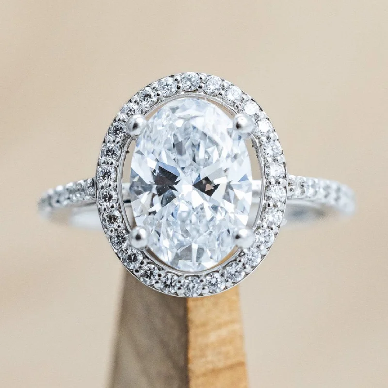 "EREN" - OVAL CUT MOISSANITE ENGAGEMENT RING WITH DIAMOND HALO & ACCENTS