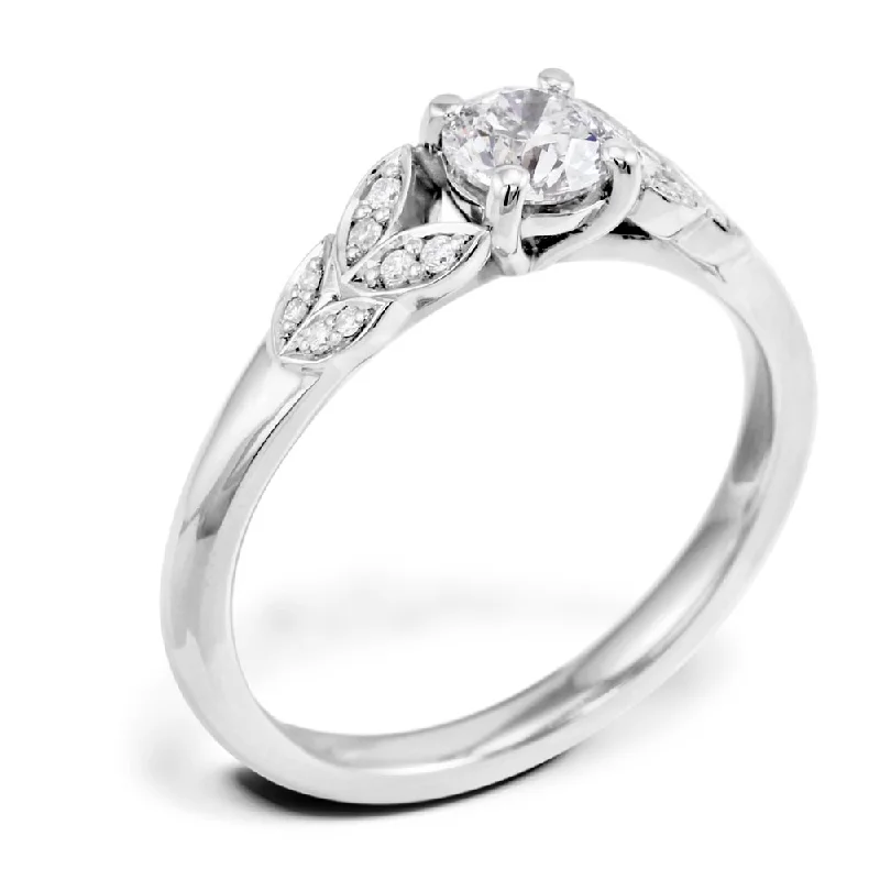 Vintage - Inspired Diamond Rings with Filigree WorkThe Fleur Platinum Round Brilliant Cut Diamond Solitaire Engagement Ring With Diamond Leaf Detailing