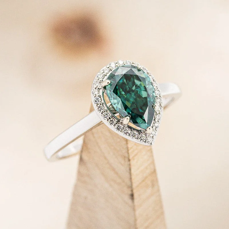 "CLARISS" - PEAR CUT MEDEINA GREEN MOISSANITE ENGAGEMENT RING WITH DIAMOND HALO