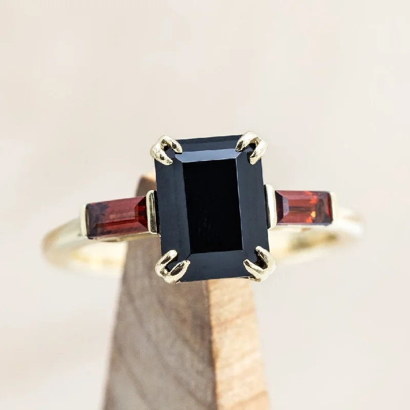 "ALBINA" - EMERALD CUT BLACK ONYX DOUBLE CLAW PRONG ENGAGEMENT RING WITH MOZAMBIQUE GARNET ACCENTS