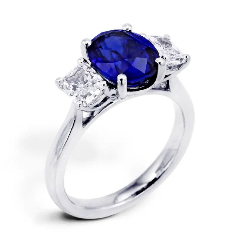 Halo - Style Diamond Rings with Smaller Accent DiamondsPlatinum 3.16ct Oval Cut Sapphire And 1.06ct Radiant Cut Diamond Three Stone Ring