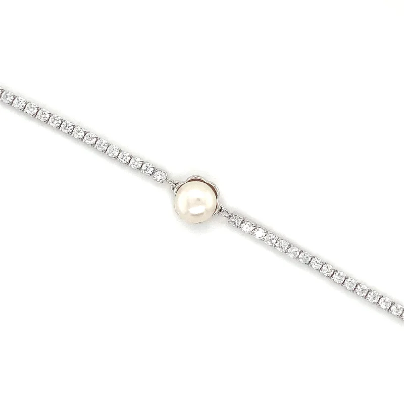 Solid Gold Bangles with Intricate EngravingsSterling Silver Tennis Bracelet with Pearl Centre