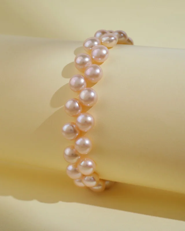 Solid Gold Bangles with Intricate EngravingsElegant Pink Pearl Bracelet